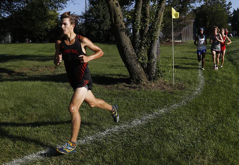 Crystal Lake Central’s Karson Hollander pulls away from Woodstock’s Ishan Patel, Prairie Ridge’s Will Gelon and Huntley’s Tommy Nitz, during the boys race of the McHenry County Cross Country Meet Saturday, August 27, 2022, at Emricson Park in Woodstock.