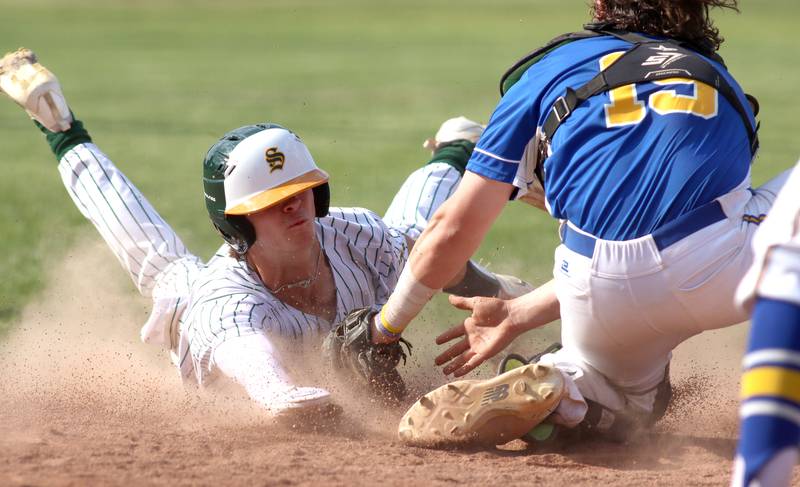 Crystal Lake South’s James Carlson is tagged out by Lake Forest’s Charlie Quick in Class 3A baseball regional action at Crystal Lake Thursday.
