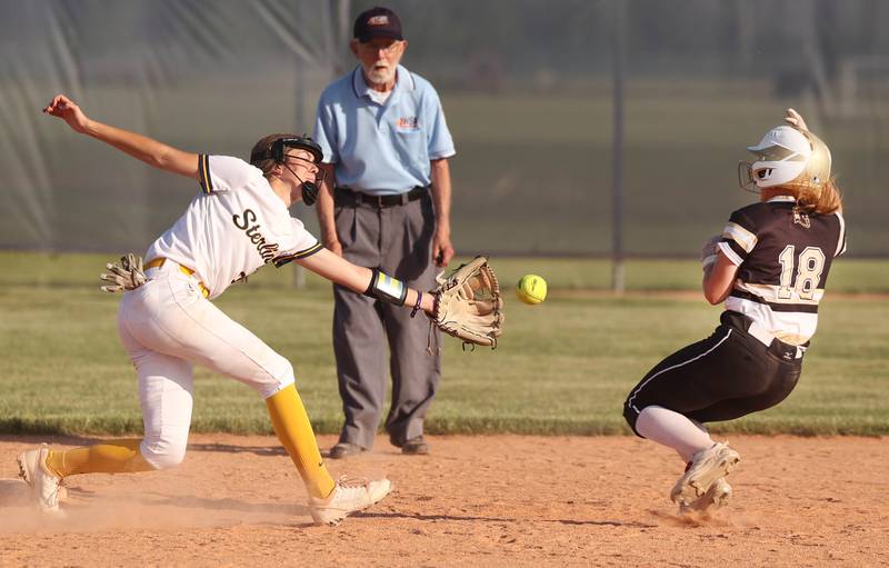 Sycamore's Addison McLaughlin steals second in the bottom of the seventh as Sterling's Katie Taylor tries to catch the throw during their Class 3A sectional championship game Friday, June 2, 2023, at Belvidere North High School.