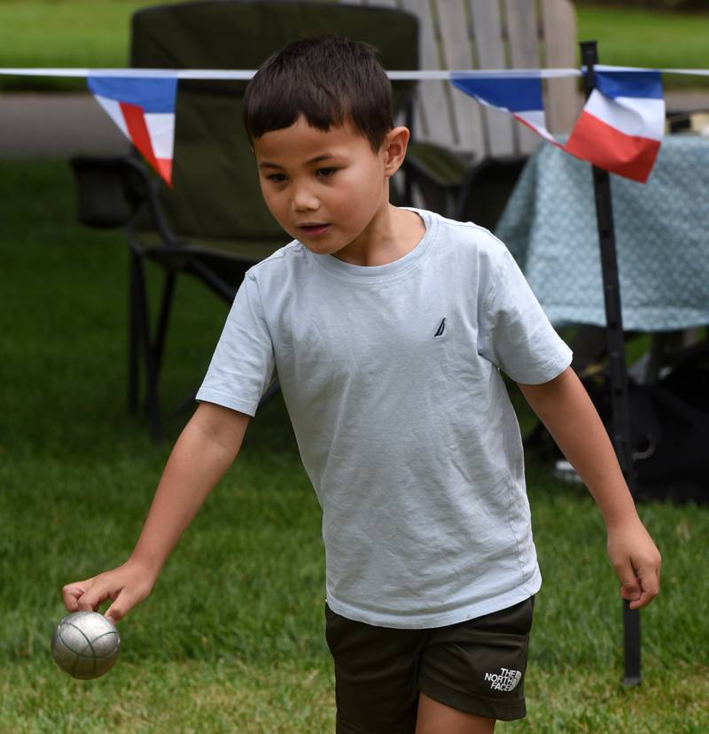 Barrett Raibley, 5, of Chicago learns to play Pétanque, a French lawn game, during the Voyage en France event at Cantigny Park on Saturday, July 20, 2024 in Wheaton.