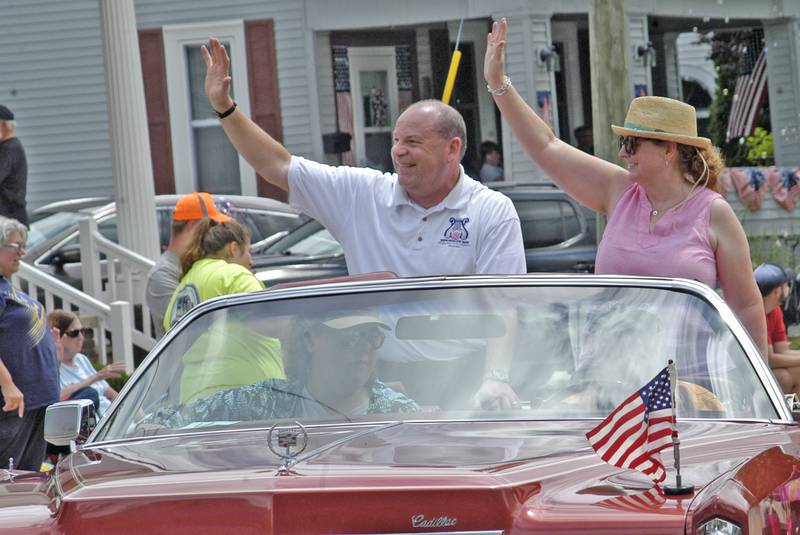 Grand Marshal Chris Hammett waves to the crowd Sunday, July 6, 2025, during the 61st annual Dixon Petunia Fest parade.