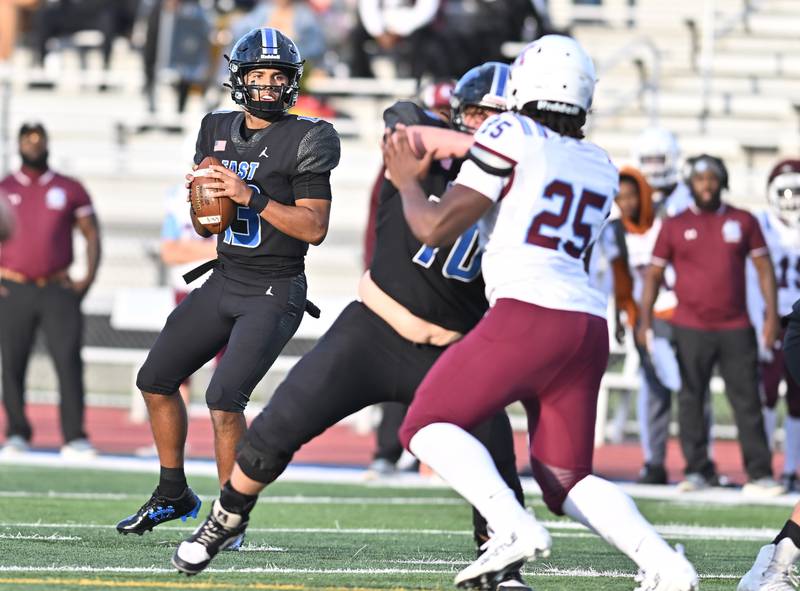 Lincoln Way East's Jonas Williams (13) going through his progressions during the non-conference game against Kankakee on Friday, Sept. 05, 2025, at Frankfort.