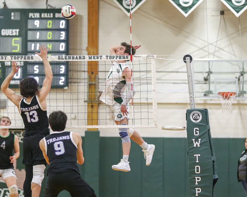 Glenbard West's Casey Maas (1) with a kill shot during volleyball match between Downers Grove North at Glenbard West.  April 2, 2024.