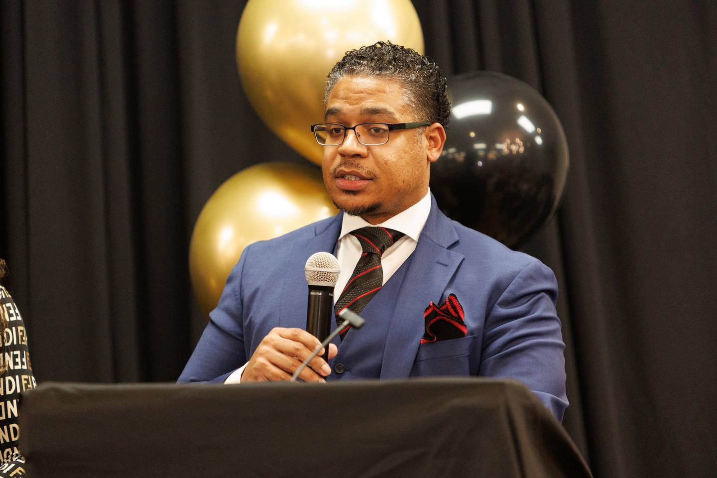 Jostin Fuqua  from Chicago Flips Red  speaks to a packed room  at the Kane County GOP Lincoln Day Dinner on Saturday, Feb.21,2026 in Elgin.