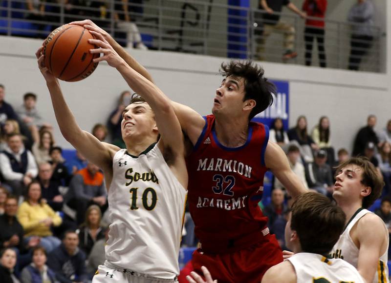 Marmion’s Henry Dalmann fouls Crystal Lake South's Cam Miller as he grabs a rebound during a IHSA Class 3A Sectional boys basketball game Tuesday, Feb. 28, 2023, at Central High School in Burlington.