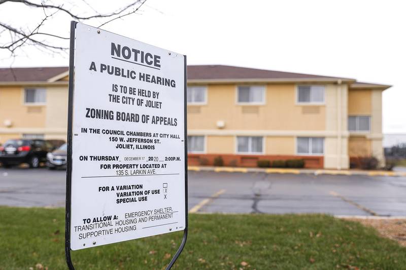 A sign outside the Quality Inn & Suites at 135 S. Larkin Ave. gives notice that the Joliet Zoning Board of Appeals on Thursday will review MorningStar Mission plans to convert the hotel into a homeless facility.