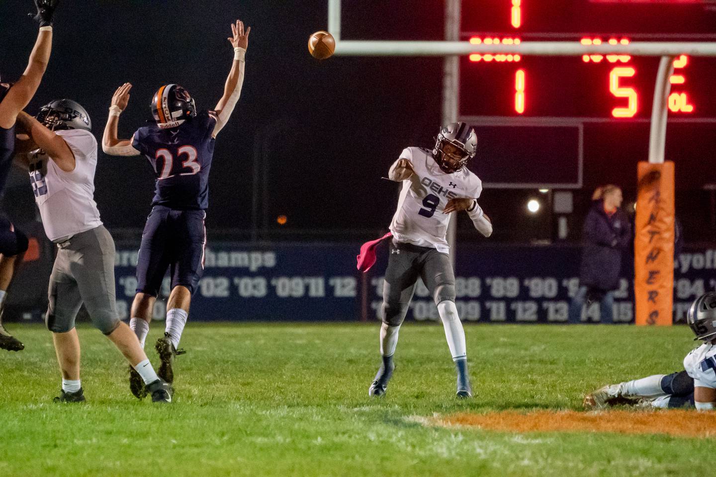 Oswego East's Tre Jones (9) throws a pass against Oswego during a high school football game at Oswego High School in Oswego on Friday, Oct 15, 2021.