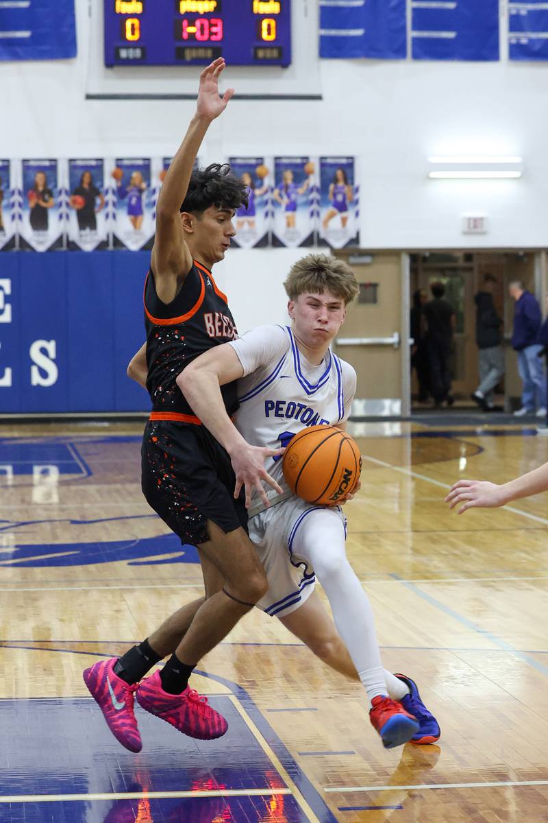 Peotone's Nick Cronin drives to the basket against Beecher's Wences Baumgartner during the Blue Devils' 64-52 victory over Beecher on Wednesday, Jan. 28, 2026.