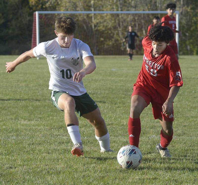 Streator’s Carlos Cueto and Coal City’s Colton Lemmons chase for ball control in the first half of Tuesday's Illinois Central Eight Conference match at the James Street Recreation Center in Streator.