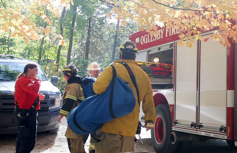 Oglesby and Utica firefighters and paramedics put away supplies after rescuing a 16-year old male who fell approximately 30 feet in the area of Cedar Point overlook on Friday, Oct. 24, 2025  at Matthiessen State Park in Oglesby. Utica and Oglesby Fire and EMS responded to the park just before 1p.m. The 16-year old patent from Elmhurst, fell down part of an embankment. Rescuers transported him to the Matthiessen shelter using a six-wheeler and then transferred by ambulance to OSF St. Elizabeth Peru. The patient suffered non-life-threatening injuries.