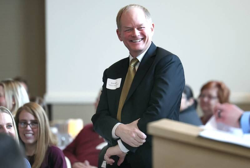 Kevin Buick from Foster, Buick, Conklin, Lundgren and Gottschalk, LLC Attorneys at Law, smiles as he is introduced during the 107th Annual Sycamore Chamber of Commerce Meeting Thursday, March 7, 2023, in Memorial Hall at St. Mary's Catholic Church in Sycamore. Foster, Buick, Conklin, Lundgren and Gottschalk, LLC Attorneys at Law were honored with the Chamber Champion award at the luncheon.