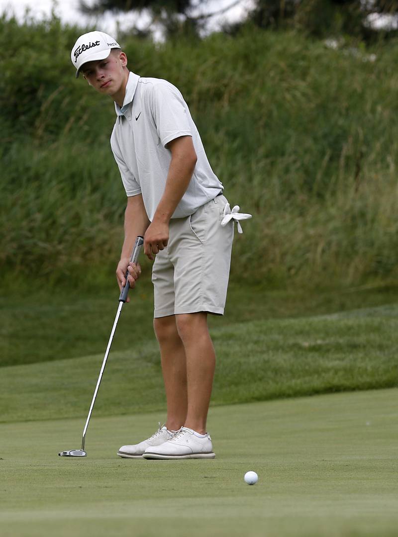 Chase Garden watches his putt on the fifth green during the final round of McHenry County Junior Amateur Golf Tournament  on Tuesday, July 18, 2025, at Foxford Hills Golf Club in Cary.