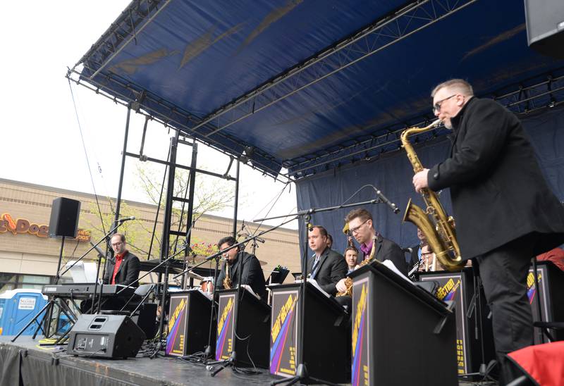 Members of Shout Section perform during the Umbrella Sky Opening Day Party held in Elmhurst Saturday April 29, 2023.