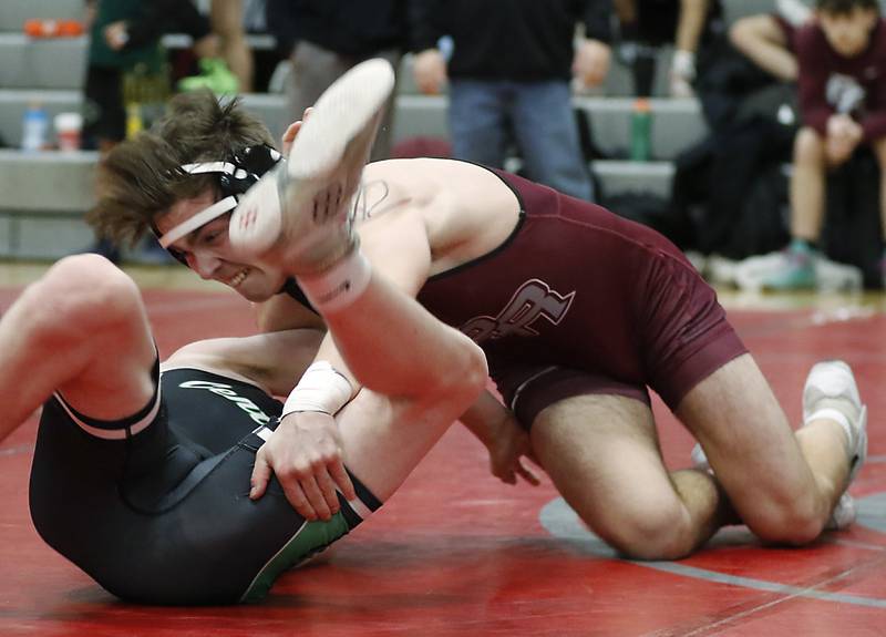 Prairie Ridge’s Mikey Meade trie to pin Grayslake Central’s Kyle Christophersen in a 126-pound match of the IIHSA 2A Antioch Wrestling Regional on Saturday, Feb. 8, 2025, at Antioch High School.