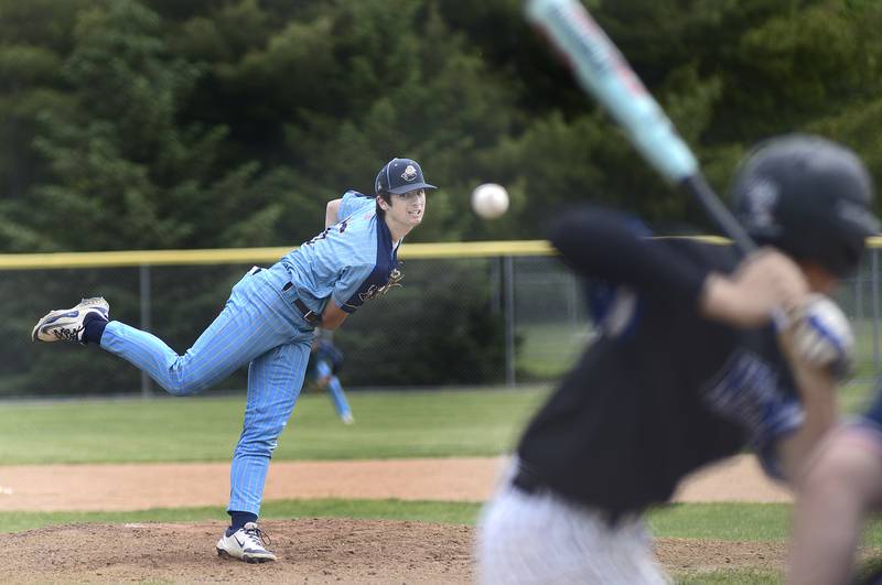 Marquette’s Alex Novotney fires a pitch Saturday against Newark pitching a complete game allowing 1 run at Masinelli Field.