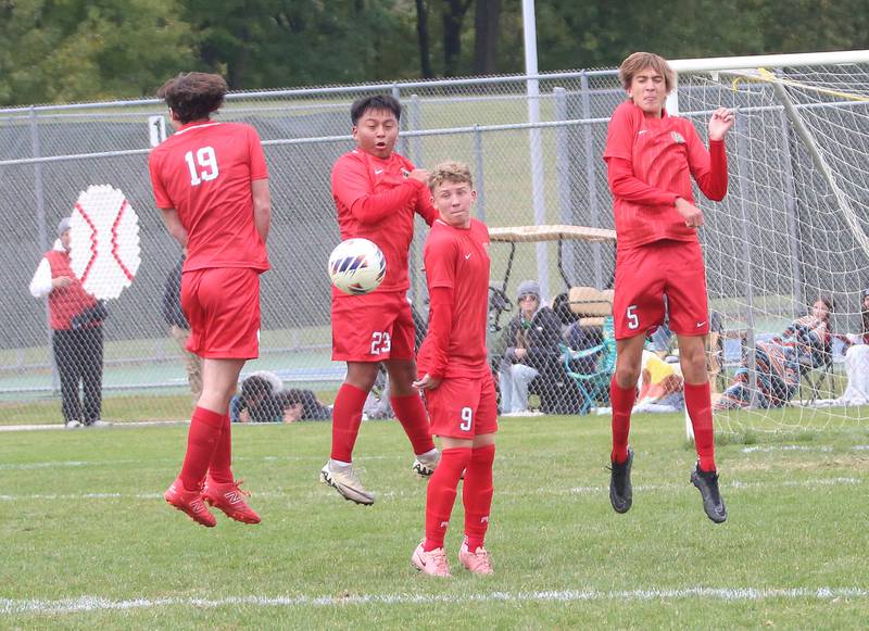 L-P's Shuarlin Cucul Cal (23)  blocks a kick with the help of teammates Ryne Bubela (19) Kyle Spelich (9) and Parker Abens (5)