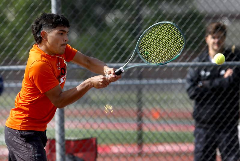 Minooka’s Eli Chavez returns the ball as he and his doubles partner, Evan Lundeen, compete in the Class 2A Boys State Tennis Tournament on Thursday, May 29, 2025, at Palatine High School.