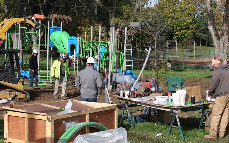 A crew from Custom Playgrounds in Rockford install new playground equipment at Sunset Park on Tuesday, Oct. 17, 2023 in Peru. Installation began this week on about $150,000 of upgraded playground equipment located on the south east part of Sunset Park near the intersection of 2nd and Henry Streets. The city received a grant of $43,000 for the new playground. Crews are hoping to have it completed by next week.