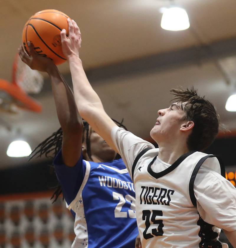 Crystal Lake Central's Aidan Watson blocks the shot of Woodstock's Marc Thomas during a nonconference boys basketball game on Monday Jan. 5,  2026, at Crystal Lake Central School.