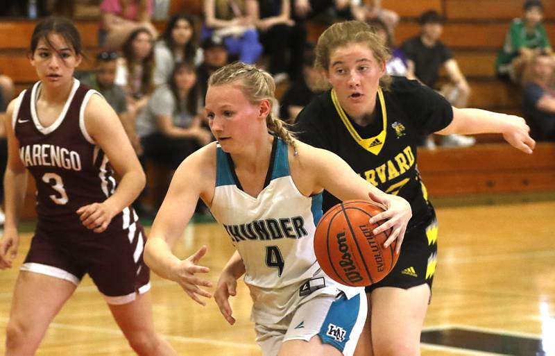 Woodstock North's Caylin Stevens drives to the basket in front of Harvard’s Ava Borchardt during the girl’s game of McHenry County Area All-Star Basketball Extravaganza on Sunday, April 14, 2024, at Alden-Hebron’s Tigard Gymnasium in Hebron.