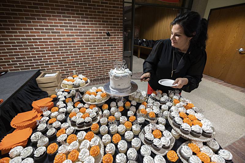 Sauk Valley YWCA executive director Rebecca Munoz-Ripley cuts a cake in celebration of milestone Friday, Jan. 19, 2024. The organization is celebrating 100 years serving the Sauk Valley.