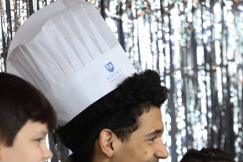 Krishaun Mays, a Freshman at SALT-RAAC Alternate School in Kankakee wears a chef hat at a nutritional and wellness event hosted by Joliet Junior College on Friday, April 21, 2023 in Joliet.