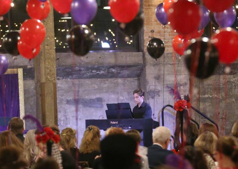 Jordan Britt a senior at Bureau Valley High School plays the piano during the 7th annual Mad Hatter Ball on Friday, Nov. 17, 2023 at the Westclox Event Center in Peru.