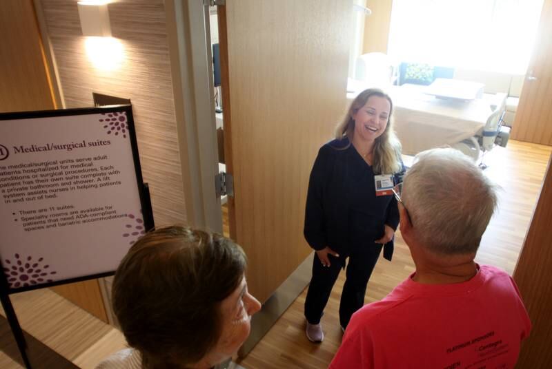 Nurse Tetyana Reshevsky greets visitors during a public open house for the new Mercyhealth hospital in Crystal Lake on Saturday.