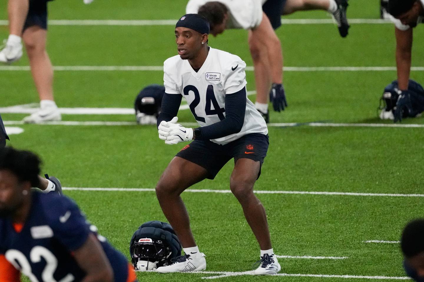 Chicago Bears' Malik Muhammad warms up with teammates during the NFL football team's rookie minicamp, Friday, May 8, 2026, in Lake Forest, Ill. (AP Photo/Nam Y. Huh)