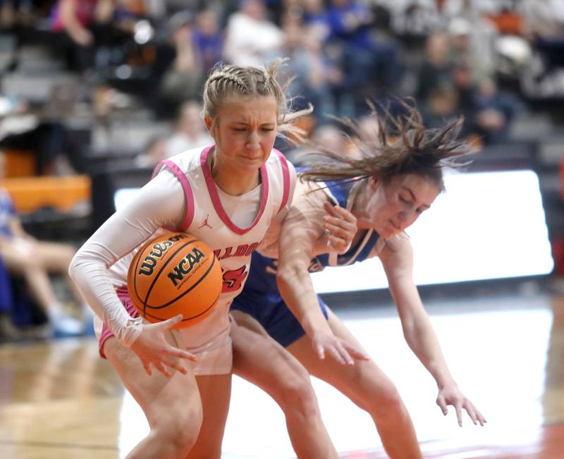 Batavia's Samantha Jansey gets the ball away from Wheaton North's Leah Roe during a Class 4A St. Charles East Sectional semifinal on Tuesday, Feb. 25, 2025 in St. Charles.