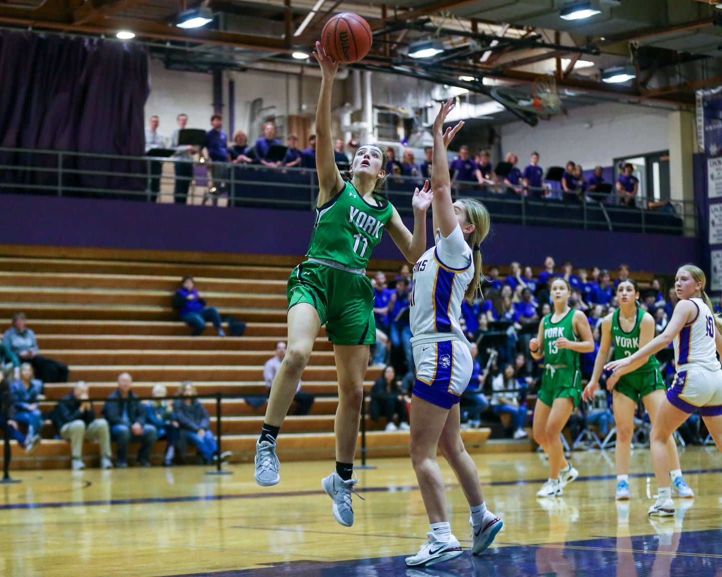 York's Mia Barton (11) puts in a lay up during basketball game between York at Downers Grove North. Dec 19, 2023.