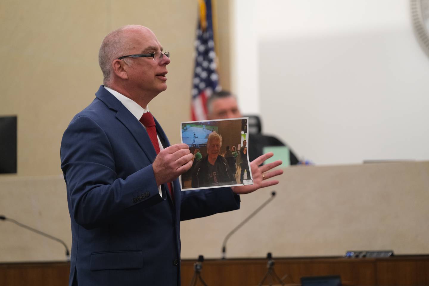 Will County Assistant State’s Attorney Tom Slazyk shows the jury a photo of Emanuel Burgarino, 76, during his closing argument in the trial of Robert Watson, 29, Thursday, May 11, 2023, at the Will County Courthouse. Watson is charged with the murder of Burgarino on March 24, 2019, at the Harrah's casino hotel in Joliet.