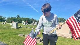 Volunteers place 1,076 American flags in Morrison’s cemetery