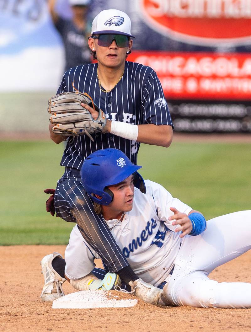 Newman Central Catholic’s Garet Wolfe slides into second and gets tagged out during a game against Hope Academy at Northwestern Medicine Field in Geneva on Monday, June 2, 2025.