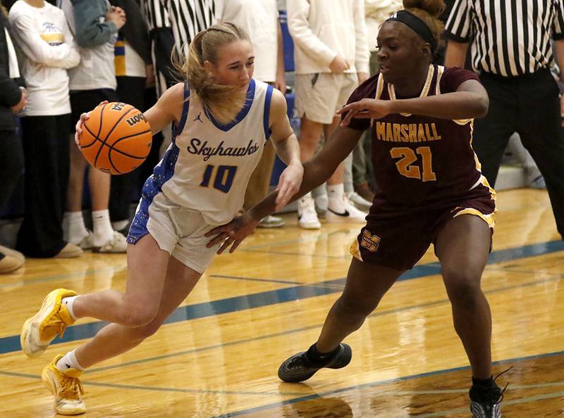 Johnsburg's Maura Oeffling tries to drive the baseline against Chicago Marshall's Alysha Murphy during a IHSA Class 2A Johnsburg Sectional girls basketball semifinal game on Tuesday, February, 24, 2026, at Johnsburg High School.