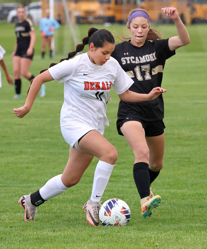 DeKalb's Ashley Hernandez tries to get past Sycamore's Addison Rodriguez Thursday, May 7, 2026, during their game at Sycamore High School.