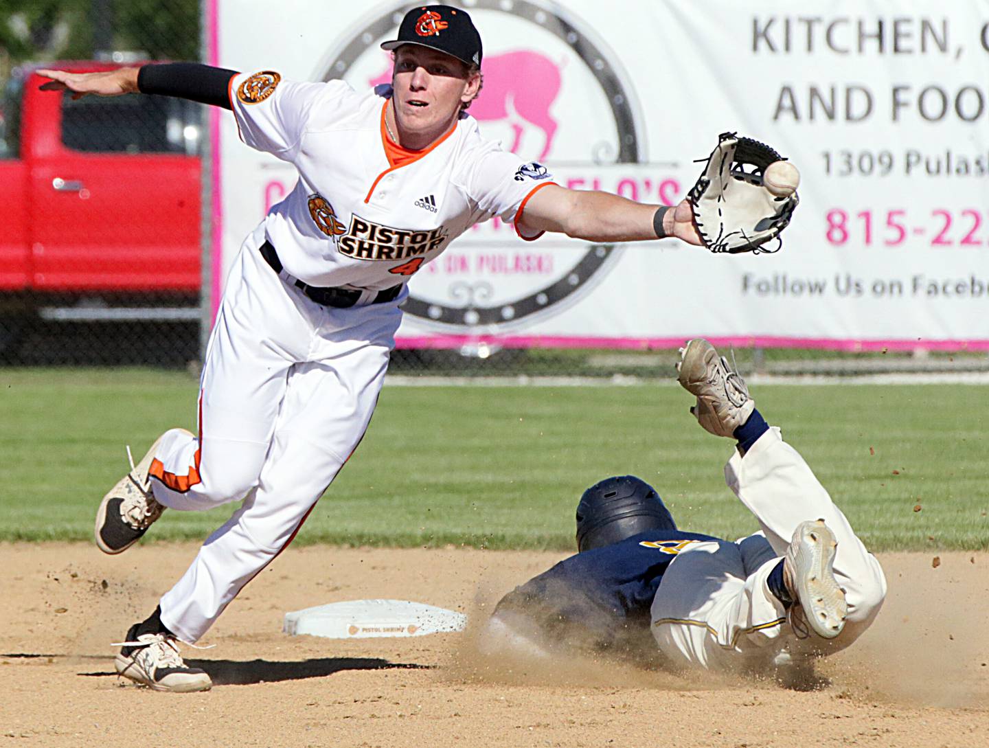 Illinois Valley Pistol Shrimp's Chance Resetich catches the ball at second base as Lafayette's Adrian Mella steals a base during the 2021 season.