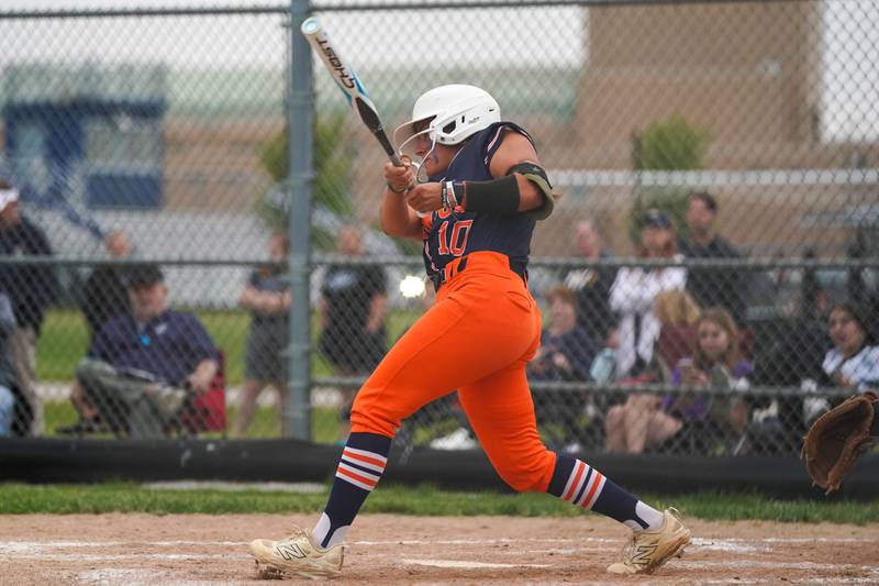 Oswego’s Kiyah Chavez (10) slaps an RBI triple against Neuqua Valley during a Class 4A Oswego East Regional Final softball game at Oswego East High School on Friday, May 30, 2025.