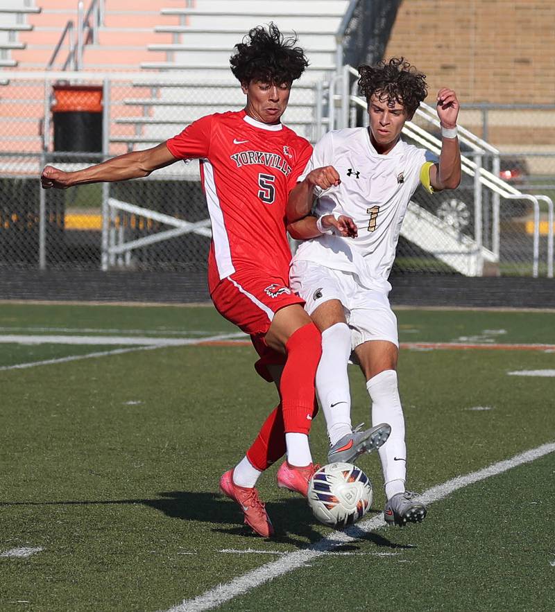 Yorkville's Andres Esparza and Sycamore's Noah Daykin fight for possession Thursday, Aug. 28, 2025, during their game in the Barb Cup tournament at DeKalb High School.