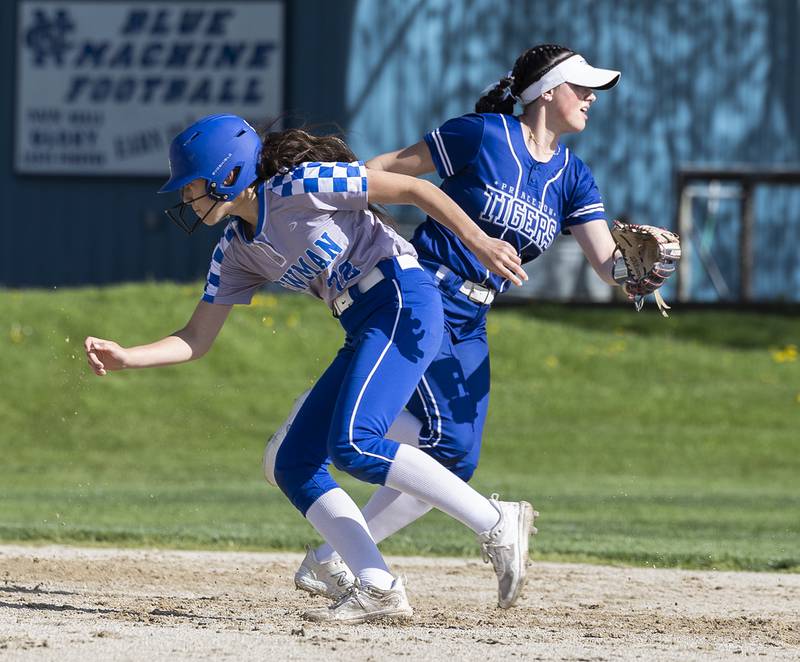 Newman’s Anna Propheter heads for third as a hit gets by Princeton shortstop Keely Lawson Monday, April 29, 2024.