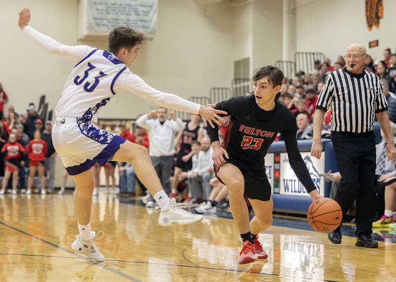 Fulton’s Brady Reed dribbles the ball against Pecatonica’a Mason Peterson during a class 1A sectional semifinal Wednesday, Feb. 28, 2024 at River Ridge High School.