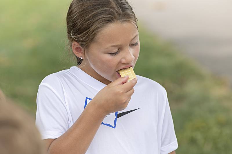 Stella samples handmade butter she made during farm camp at Woodlawn Arts Academy on Thursday, June 29, 2023. Campers spent the week learning about agriculture and visiting farms through the Whiteside County Farm Bureau.