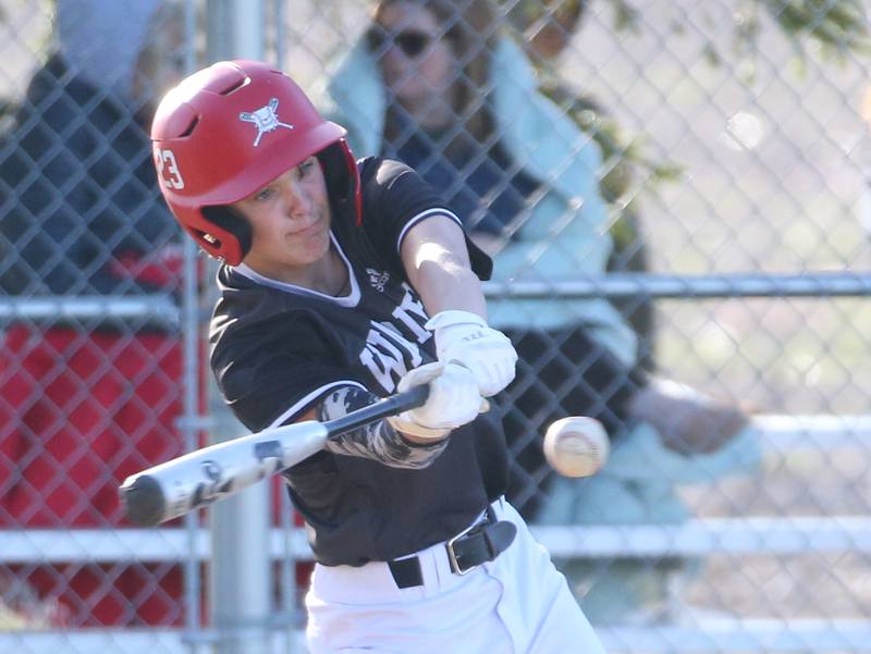 Woodland/Flanagan-Cornell's Nolan Price makes contact with the ball against Putnam County on Tuesday, April 9, 2024 at Woodland High School.