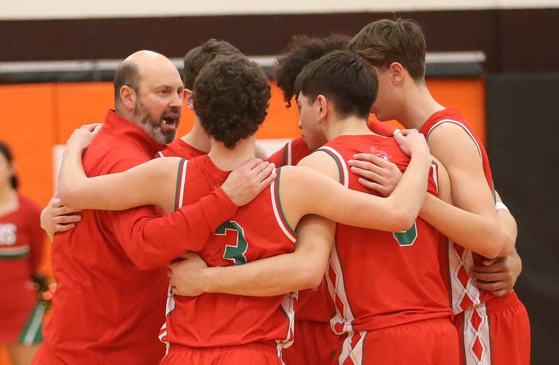 L-P head basketball coach John Senica huddles up his team before plaing Peoria during the Class 3A Sectional semifinal game on Wednesday, March 5, 2025 at Washington High School.