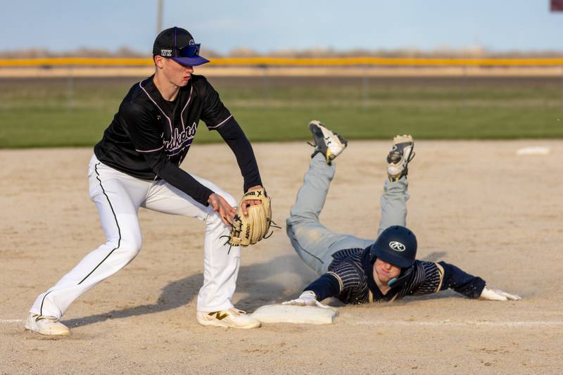 Kamden Rasmus of Hiawatha slides into third base on Monday, April 7, 2025 at Serena High School in Serena.