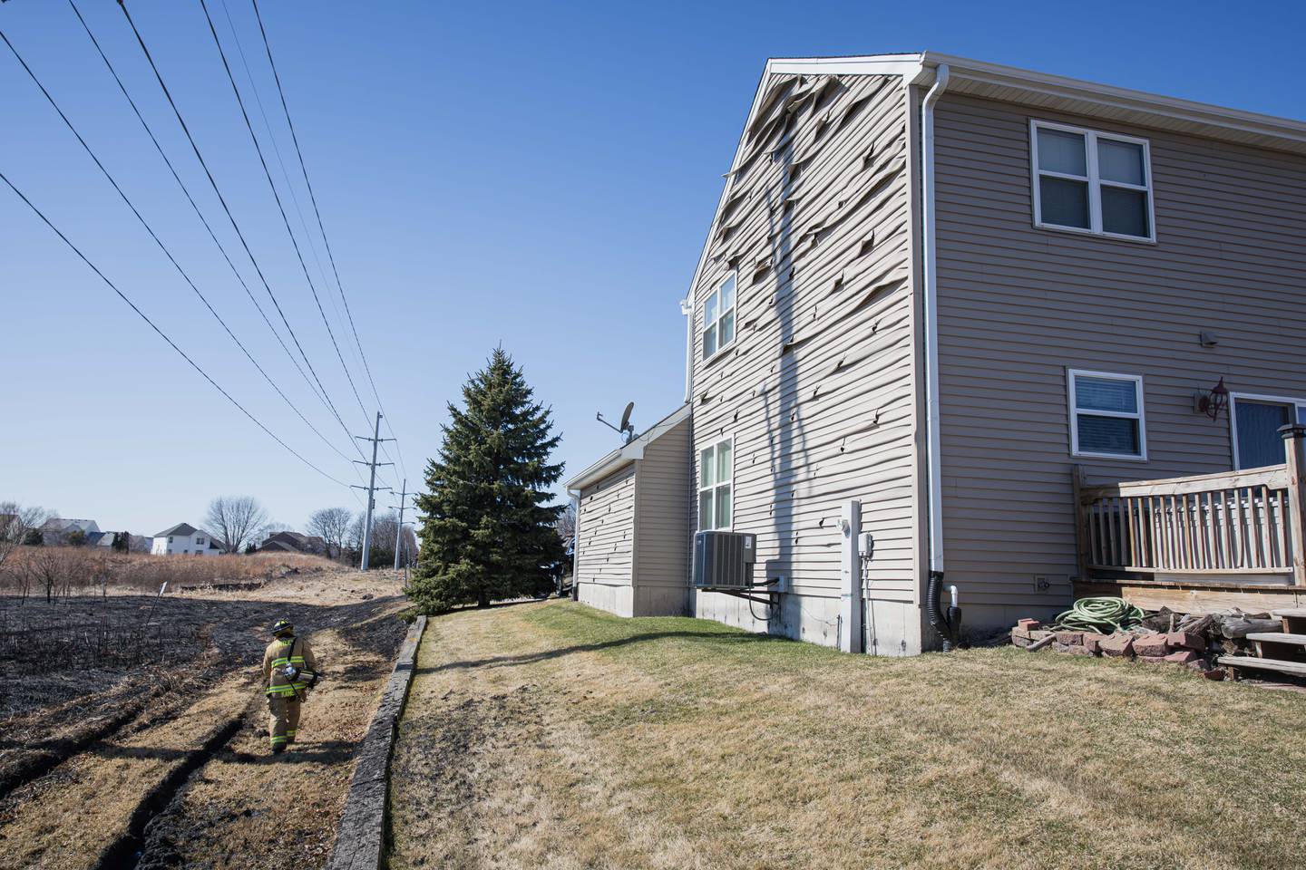 Four acres burned and a house was damaged following a brush fire in Lake in the Hills Monday, March 9, 2026.