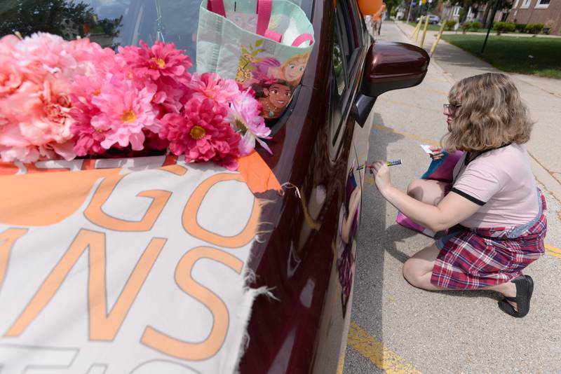 People including Tobi Klein of Naperville decorate their vehicles for the Berwyn Pride Parade held Saturday June 15, 2024.