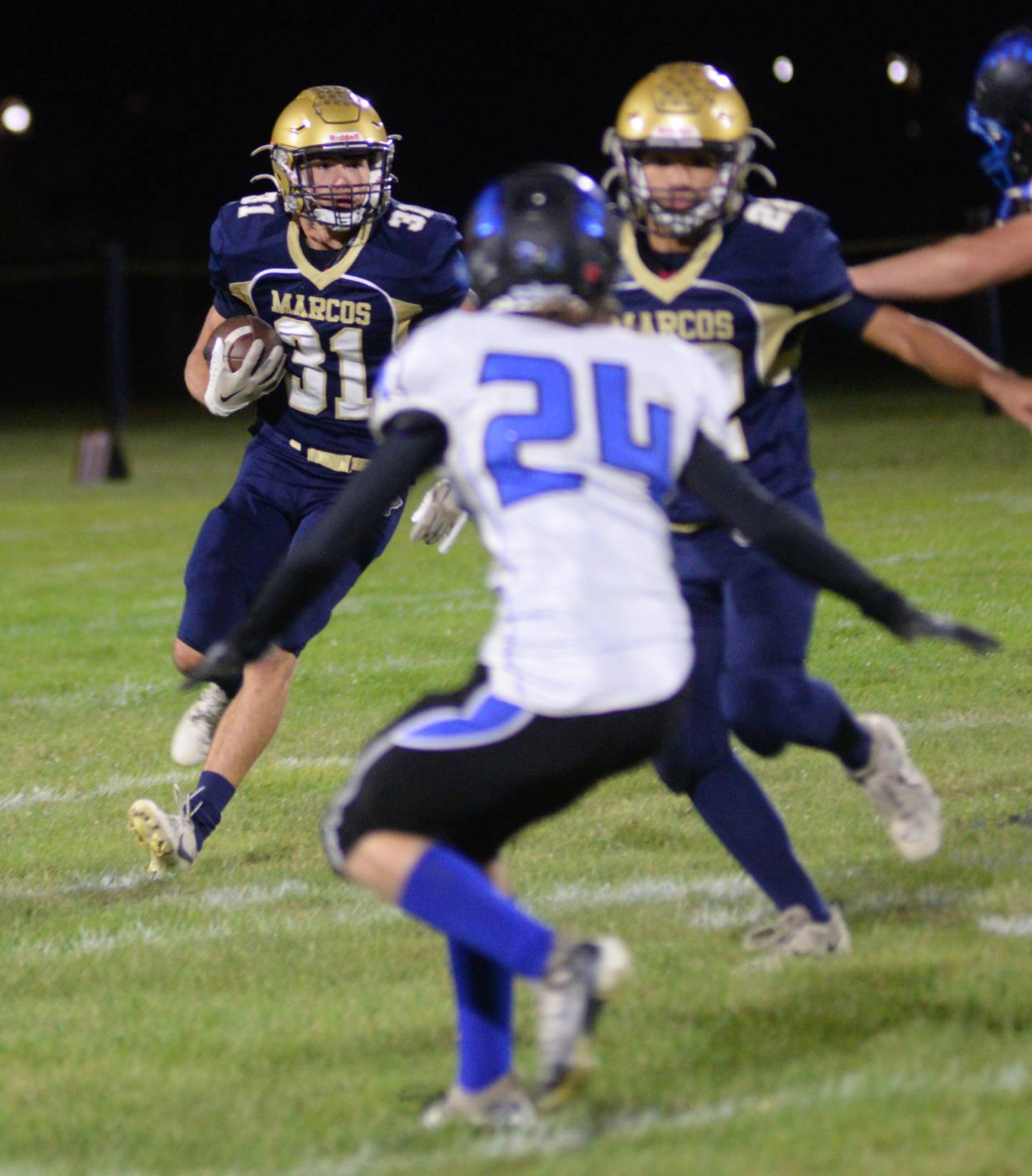 Polo's Noah Dewey (31) looks for hole as DeAngelo Fernandez (22) blocks a Blue Ridge player during Friday, Oct. 6, 2023 action at Polo High School.