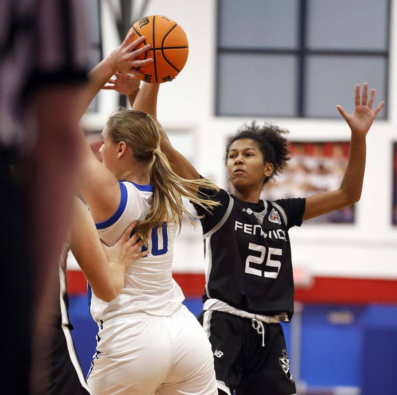 Fenwick's Eleanor Gibson (25) tries to block a pass from a St. Charles North player during the Dundee-Crown High School 41st Annual Komaromy Classic Friday, Dec. 27, 2024 in Carpentersville.