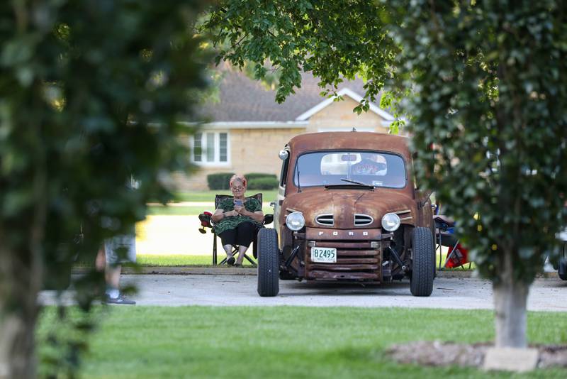 Kathy Understahl, of Kankakee, accompanies her Ford truck on display during the Cruise-In Night at the Museum on Thursday, Aug. 14, 2025.